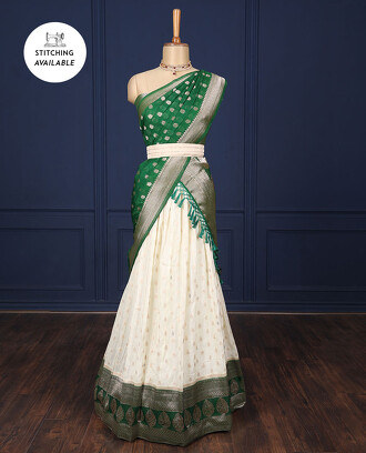 Cream+art-silk+half-saree+with+zari+buttas%2C+contrast+green+traditional+zari+border%2C+jacquard+blouse+%26+intricate+dhavani