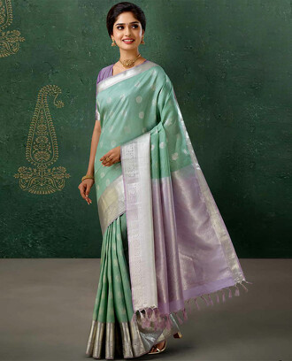 Green+striped+vasundhara+silk+mix+saree+with+mayil+chakra+buttas%2C+contrast+traditional+zari+border+%26+intricate+pallu