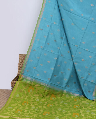 Blue+uppada+saree+with+zari+buttas%2C+contrast+plain+border+%26+pallu+of+floral+jaal+designs+
