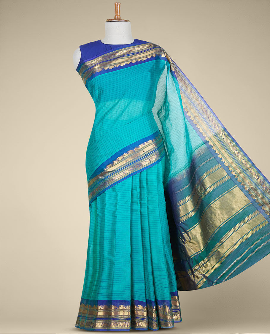 Lite blue embossed Art Silk Saree with flower buttas, contrast border &  pallu features intricate designs